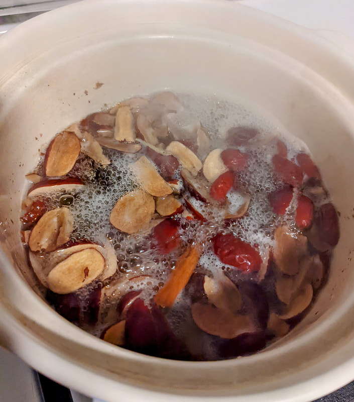 jujube date, cinnamon, and ginger boiling in water